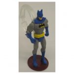 Action figure with shower curtain ring glued to back for easy gripping