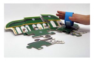 Velcro bracelet helps pick up puzzle pieces