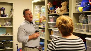 Volunteers search fabricATe's closet for parts.