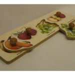 Board puzzle with wooden handles attached for easy grasping