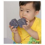 Example of child playing with textured blocks