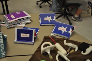 A table containing many of the items constructed during the fab lab.