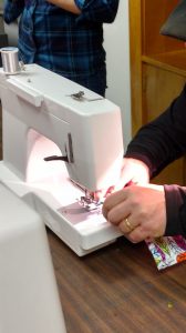 Sewing a garment protector.