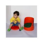 An example of a child using a barrel seat.