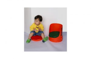 An example of a child using a barrel seat.